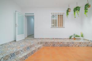 an empty room with a door and a tile floor at Les Villetes in Moncófar +69 photos
