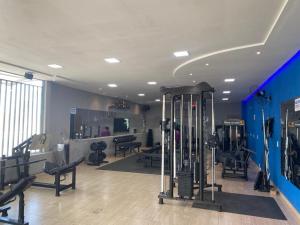 a gym with many exercise equipment in a room at HOTEL FÊNIX in Campina Grande