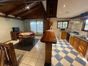 a large kitchen with a island in the middle at Casa Calma in Eldorado +11 photos