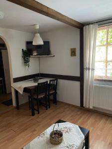 a living room with a table and chairs and a dining room at Chalet Traian & Ruxandra in Sinaia