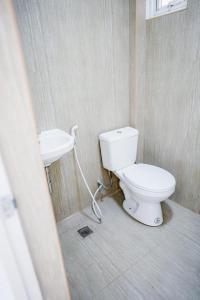 a bathroom with a toilet and a sink at Jannish Transient House in Masbate +19 photos