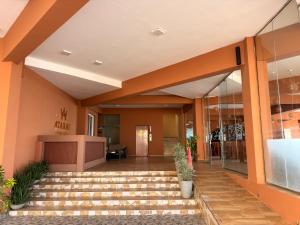 an empty lobby of a building with stairs at Atarah Beach Hotel in Negombo +41 photos