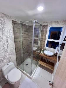 a bathroom with a shower and a toilet and a sink at Hotel Sol Caribe Cartagena in Cartagena de Indias +21 photos