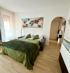 a bedroom with a bed and a couch in it at Ale’s House in Venice-Lido