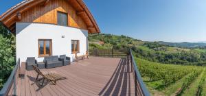 a house with a deck with a view of a vineyard at Vineyard cottage Mehak in Telče