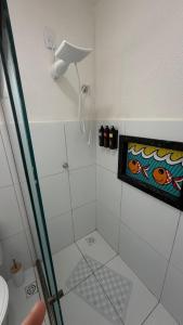 a bathroom with a shower with a glass door at Casa nova e aconchegante em condomínio in Petrolina +32 photos