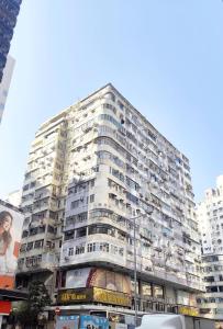 a large apartment building in a city at In Inn in Hong Kong