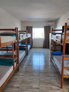 a room with a bunch of bunk beds at Hostel Vista Mar in Porto Seguro +57 photos