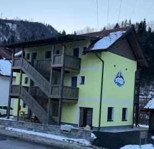 a building with stairs on the side of it at Gesäuse-Zimmer-Motel in Hieflau +28 photos