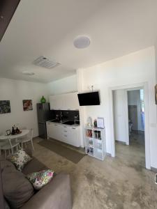 a living room with a couch and a table at Agri Residence Verde Oliva in Ispica