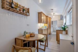 a kitchen with a table and a small table and a kitchen at 2 Bed in Hunningham oc-h34740 in Bubbenhall