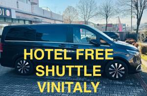 a hotel free shuttle van with the words hotel free shuttle at Hotel Pex Verona in Verona