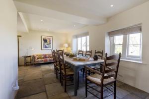 a dining room with a table and chairs at 4 Bed in Middleham oc-c34754 in Caldbergh +24 photos