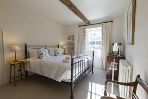 a bedroom with a bed and a window at 4 Bed in Middleham oc-c34754 in Caldbergh