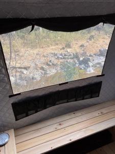 a window in a room with a wooden bench under it at 川辺の宿-Kawabe-BBQ-川遊び in Hanno