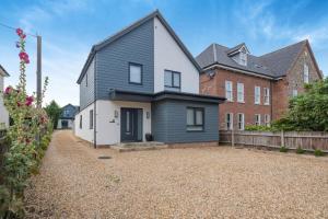 a home with a black and white house at 2 Bed in Holt oc-l31797 in Holt