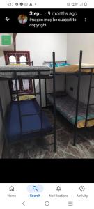 a room with two bunk beds in a room at pondicherry hostel in Pondicherry