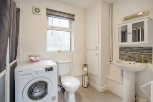 a bathroom with a washing machine and a sink at 2 Bed in Trefil oc-n34478 in Nant-y-bwch +30 photos