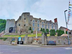 a large castle sitting on the side of a street at 2 Bed in Trefil oc-n34478 in Nant-y-bwch