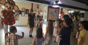a group of people standing in a store with a mickey mouse costume at Camping La Siesta - Maeva in L'Aiguillon-la-Presqu'île +25 photos