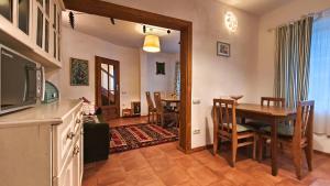 a living room with a table and a dining room at PORTALA Urban Lodge in Rila +24 photos