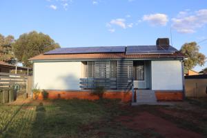 a small house with solar panels on the roof at The Sundown Stay in Dubbo