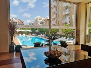 a view of a swimming pool from a hotel room at Hotel Tropics & Venera - Ultra All Inclusive in Sveti Vlas