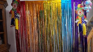 a wall with a bunch of bangles and balloons at Hengeler's hof in Altusried