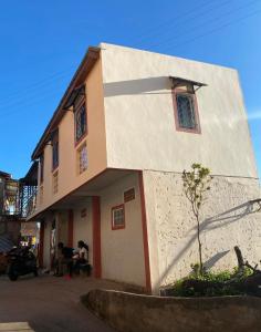 a building with a white and orange at Akany Sahoby in Antananarivo