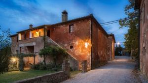 an old building with a large rusted at Montestigliano in Sovicille