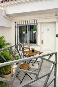 a patio with a table and chairs on a balcony at Concept Rooms in Costa de Adeje