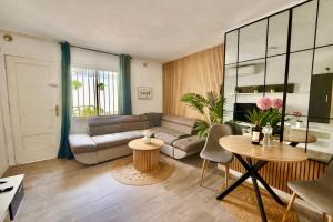 a living room with a couch and a table at Concept Rooms in Costa de Adeje