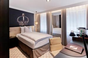 Un pat sau paturi într-o cameră la Sorell Boutique-Hotel Krone Winterthur +11 fotografii