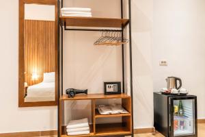 a room with a bunk bed and a mirror at ABEDINI Boutique Hotel Ksamil in Ksamil