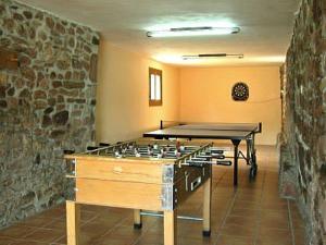 a room with a ping pong table in a room at Casa Artxea in Arráyoz