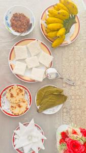 a table with plates of cheese and other foods at Royal Villa in Ahangama +35 photos