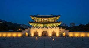 a large building with a tower at night at Maison Stay in Samgong