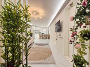 a hallway with a living room and a dining room at Maison Stay in Samgong