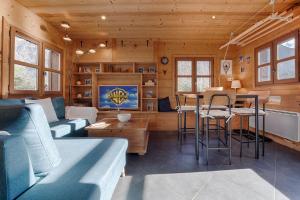 a living room with a couch and a table at Tiny Chalet - near to Servoz train station in Les Houches