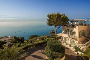 a large house with a view of the ocean at Hotel Raito in Vietri sul Mare
