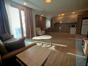 a living room with a couch and a table at Suitev in Arnavutköy