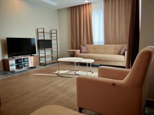a living room with a couch and a table at Suitev in Arnavutköy