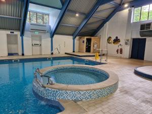 a large swimming pool in a building at St Minver Hideaway in Saint Minver