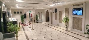 a hallway with potted plants in a building at Saad in Cairo