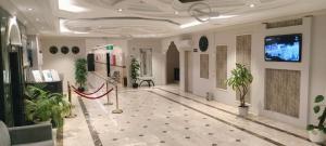 a hallway with potted plants in a building at Saad in Cairo