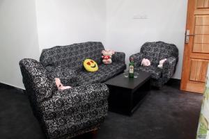 two chairs and a table with stuffed animals on them at Riverside Bliss Cottage in Demodera +13 photos