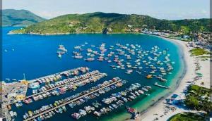 an aerial view of a marina with boats in the water at Casa temporada in Arraial do Cabo