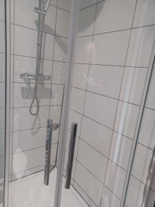 a shower in a bathroom with a glass door at Masons Nook 292 Mansfield Road NG174HR in Skegby +12 photos