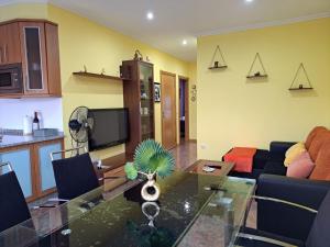 a living room with a table and a couch at Suseia in Arcade