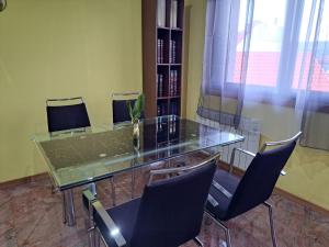 a conference room with a glass table and chairs at Suseia in Arcade